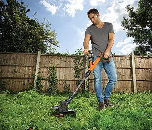 Cordless strimmer being used