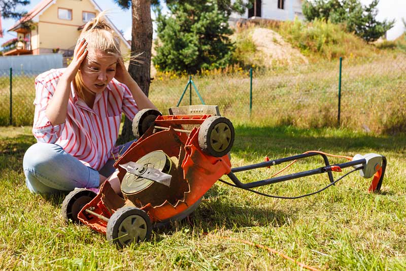  Person with broken lawnmower