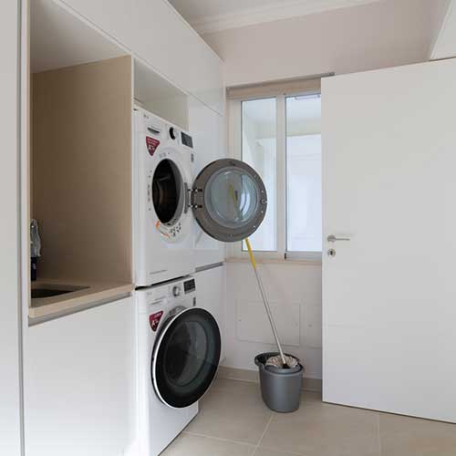  Tumble dryer stacked on washing machine