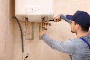 plumber repairing domestic boiler