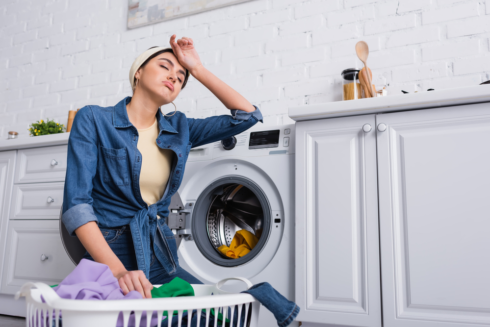 woman by washing machine